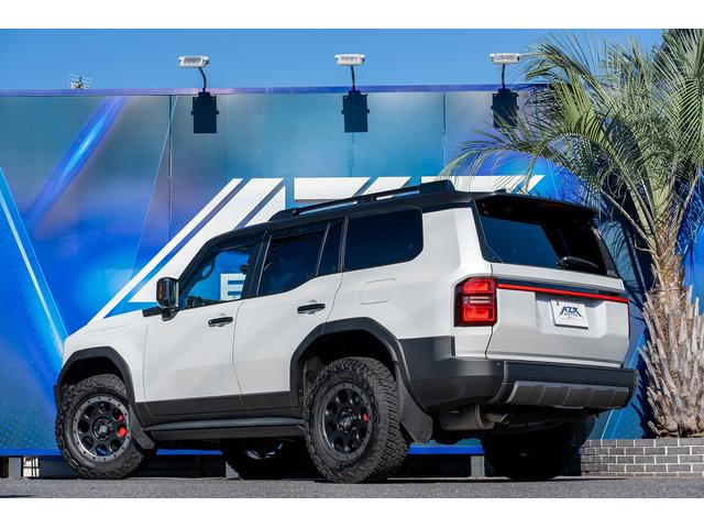 ランドクルーザー250 VX ボディーラッピング エクストリームJ サンルーフ VIPERセキュリティ 社外テールランプ(一文字テール) 社外サイドステップ 黒革シート Wエアコン ルーフレール エクストリーム18インチAW(5枚目)