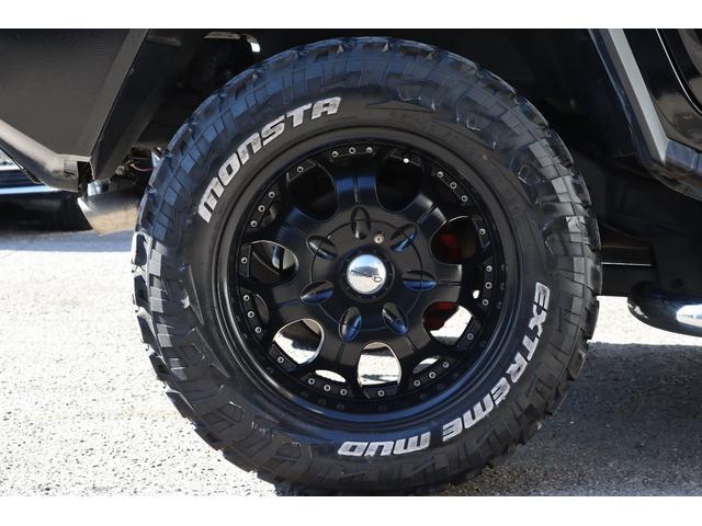 ハマーH2 ラグジュアリーパッケージ 後期モデル バネサス変更済み 3列シート ジオバンナ20AW メッキグリルガード メッキパーツカスタム サイドステップ LEDヘッドライト イルミネーション 黒革シート 社外ナビ(4枚目)