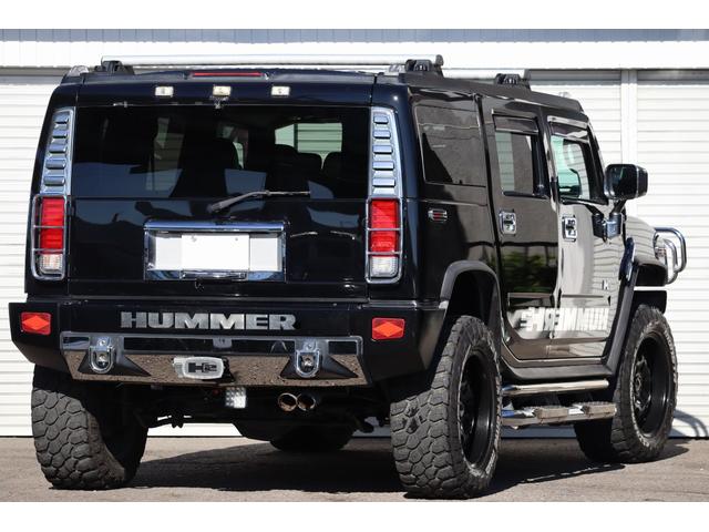 ハマーH2 ラグジュアリーパッケージ 後期モデル バネサス変更済み 3列シート ジオバンナ20AW メッキグリルガード メッキパーツカスタム サイドステップ LEDヘッドライト イルミネーション 黒革シート 社外ナビ(9枚目)