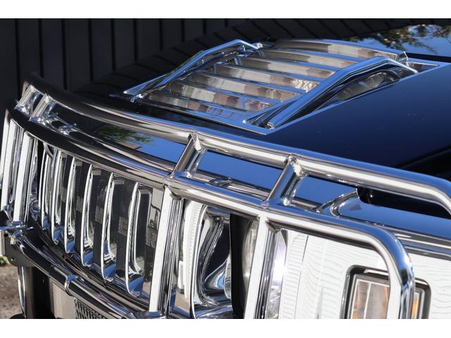 ハマーH2 ラグジュアリーパッケージ 後期モデル バネサス変更済み 3列シート ジオバンナ20AW メッキグリルガード メッキパーツカスタム サイドステップ LEDヘッドライト イルミネーション 黒革シート 社外ナビ(17枚目)