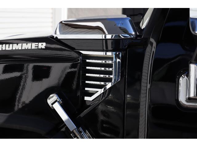 ハマーH2 ラグジュアリーパッケージ 後期モデル バネサス変更済み 3列シート ジオバンナ20AW メッキグリルガード メッキパーツカスタム サイドステップ LEDヘッドライト イルミネーション 黒革シート 社外ナビ(19枚目)