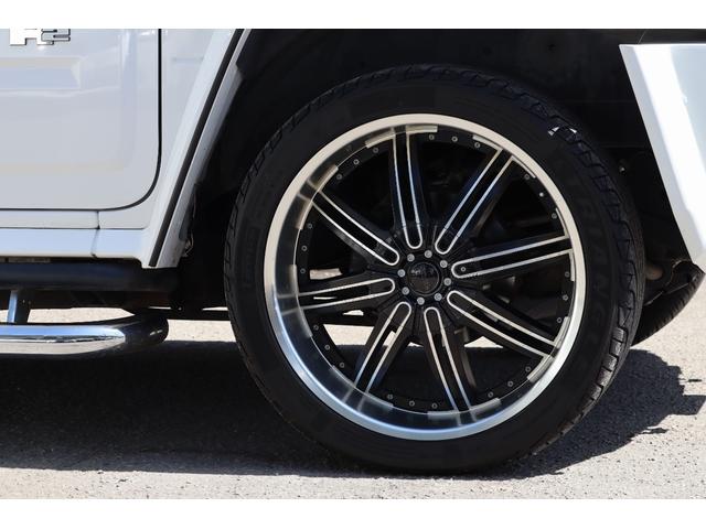 ハマーＨ２ アドベンチャーパッケージ　ラグジュアリーパッケージ　１ナンバー登録　セカンドキャプテンシート　社外エアロ　メッキパーツ　サイドステップ　２４インチＡＷ　社外ナビ　同色パーツカスタム　サンルーフ（4枚目）