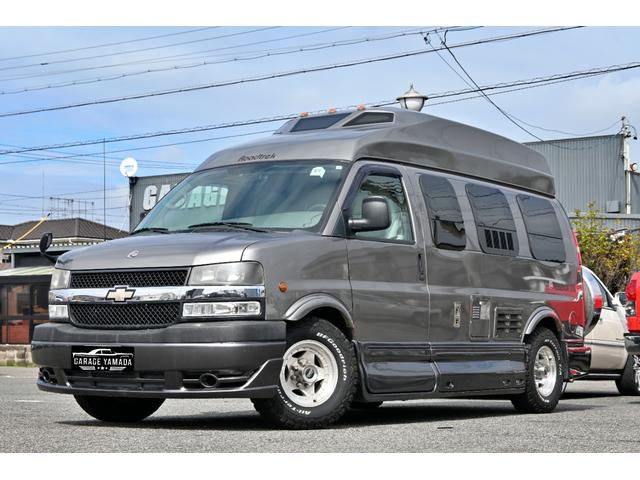 シボレーエクスプレス  ロードトレック170 ヴァーサタイル 2011年モデル 実走行証明書 オートチェック&カーFAX ジェネレーター エアコン 冷蔵庫 電子レンジ 2口コンロ サイドオーニング シンク 電動ソファーベッド(3枚目)