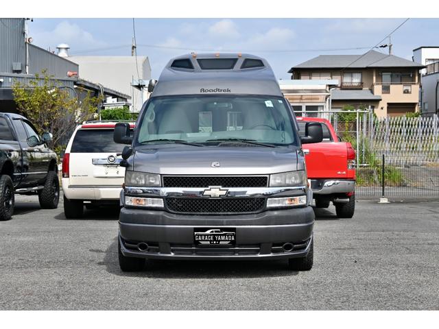 シボレーエクスプレス  ロードトレック170 ヴァーサタイル 2011年モデル 実走行証明書 オートチェック&カーFAX ジェネレーター エアコン 冷蔵庫 電子レンジ 2口コンロ サイドオーニング シンク 電動ソファーベッド(5枚目)