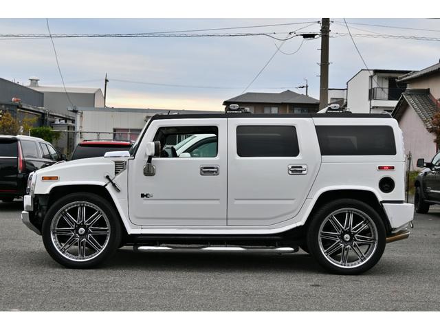 ハマーＨ２ ラグジュアリーパッケージ　２００５ｙモデル　サンルーフ　黒本革シート　ＡＳＡＮＴＩ２６インチホイール　フルセグＴＶナビ　社外マフラー　サイドステップ　メッキパーツ　ＥＴＣ１ナンバー５人乗り（5枚目）