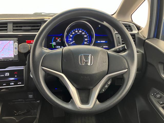 フィットハイブリッド Ｆパッケージ　修復歴無し　車検整備付　１２ヶ月保証付き　純正ナビ　バックカメラ　Ｂｌｕｅｔｏｏｔｈ　ＥＴＣ　ＣＤ／ＤＶＤ　スマートキー　プッシュスターター　スペアキー　電動格納ミラー　社外１５インチアルミホイール（11枚目）