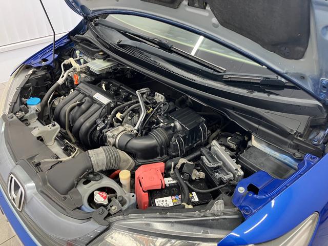 フィットハイブリッド Ｆパッケージ　修復歴無し　車検整備付　１２ヶ月保証付き　純正ナビ　バックカメラ　Ｂｌｕｅｔｏｏｔｈ　ＥＴＣ　ＣＤ／ＤＶＤ　スマートキー　プッシュスターター　スペアキー　電動格納ミラー　社外１５インチアルミホイール（58枚目）