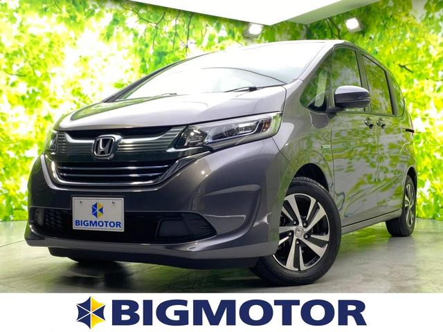 ホンダ フリードハイブリッドハイブリッドｅｘ 純正 ７インチ メモリーナビ フリップダウンモニター 両側電動スライドドア シート ハーフレザー 車線逸脱防止支援システム ヘッドランプ ｌｅｄ ｅｔｃ ｅｂｄ付ａｂｓ 横滑り防止装置 後席モニターの中古車 18