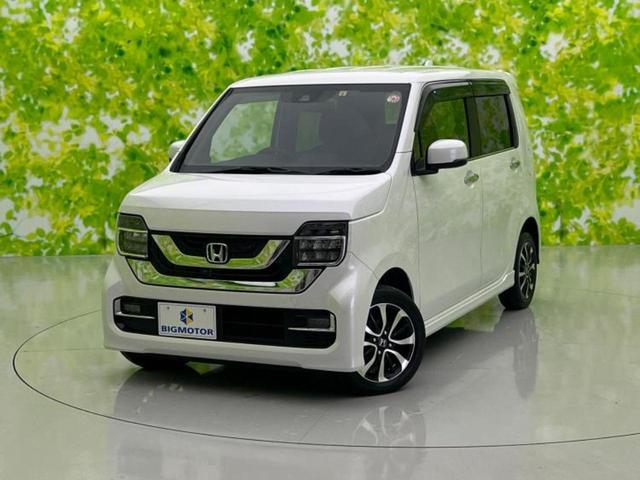 Ｎ−ＷＧＮカスタム(ホンダ) ４ＷＤ　Ｌ・ホンダセンシング　保証書／純正　８インチ　ＳＤナビ／ホンダセンシング／シートヒーター　前席／車線逸脱防止支援システム／パーキングアシスト　バックガイド／ヘッドランプ 中古車画像