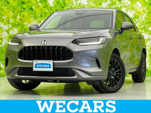 ZR−V(ホンダ) eHEV Z 新品タイヤ/BOSE/保証書/ディスプレイオーディオ+ナビ8インチ/ホンダセンシング/シートヒーター 前席/マルチビューカメラシステム/車線逸脱防止支援システム/シート 合皮/電動バックドア ドラレコ 中古車画像