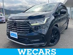 オデッセイハイブリッド eHEVアブソルート・EXブラックエディション 保証書/純正 11インチ ナビ/フリップダウンモニター 純正 15.6インチ/ホンダセンシング/両側電動スライドドア/シートヒーター/マルチビューカメラシステム/車線逸脱防止支援システム 後席モニター 中古車画像