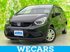 フィット eHEVホーム 保証書/純正 9インチ SDナビ/衝突安全装置/車線逸脱防止支援システム/シート ハーフレザー/パーキングアシスト バックガイド/ヘッドランプ LED/USBジャック 衝突被害軽減システム DVD再生 中古車画像