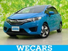 フィットハイブリッド ハイブリッド・Fパッケージ 純正 SDナビ/パーキングアシスト バックガイド/ヘッドランプ LED/Bluetooth接続/ETC/EBD付ABS/横滑り防止装置/アイドリングストップ/バックモニター/ワンセグTV バックカメラ 中古車画像