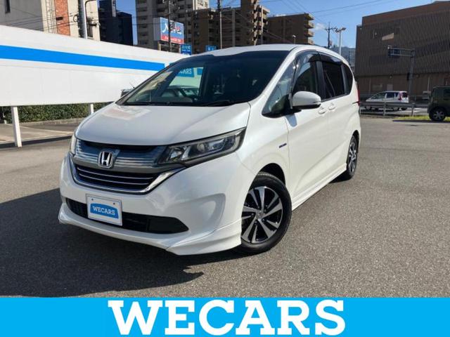 フリードハイブリッド ハイブリッドEX 新品タイヤ/純正エアロ/保証書/純正 SDナビ/ホンダセンシング/両側電動スライドドア/シートヒーター 前席/車線逸脱防止支援システム/シート ハーフレザー/ヘッドランプ LED 衝突被害軽減システム(1枚目)