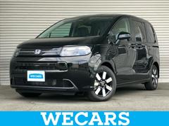 フリード eHEVエアーEX 保証書/純正 9インチ メモリーナビ/ホンダセンシング/両側電動スライドドア/シートヒーター 前席/登録済未使用車/ヘッドランプ LED/USBジャック/Bluetooth接続/EBD付ABS 中古車画像