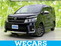 ヴォクシー 4WD ZSキラメキ 保証書/社外 9インチ SDナビ/フリップダウンモニター 社外 10.1インチ/両側電動スライドドア/ヘッドランプ HID/ETC/EBD付ABS/横滑り防止装置/アイドリングストップ 後席モニター 中古車画像