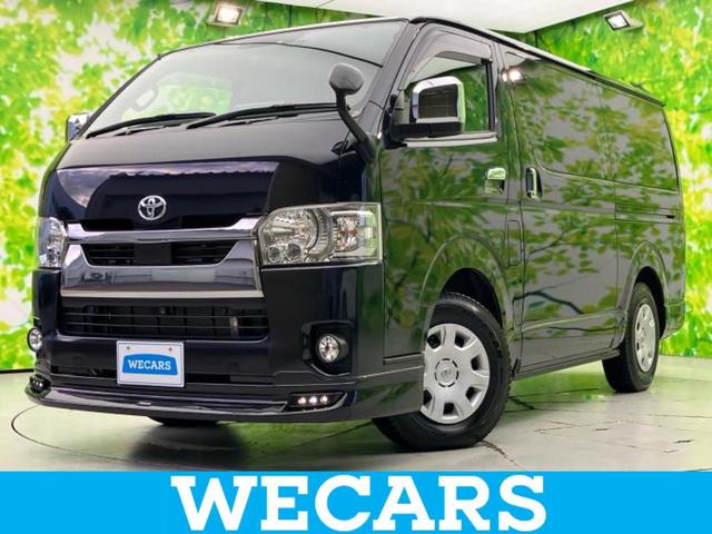 ハイエースバン(トヨタ) ４ＷＤロングスーパーＧＬダークプライム２　新品タイヤ／エアロ／保証書／Aftermarket　１１インチ　ＳＤナビ／トヨタセーフティセンス／両側電動スライドドア／車線逸脱防止支援システム／ヘッドランプ　ＬＥＤ／Ｂｌｕｅｔｏｏｔｈ接続／ＥＴＣ／ＥＢＤ付ＡＢＳ 中古車画像