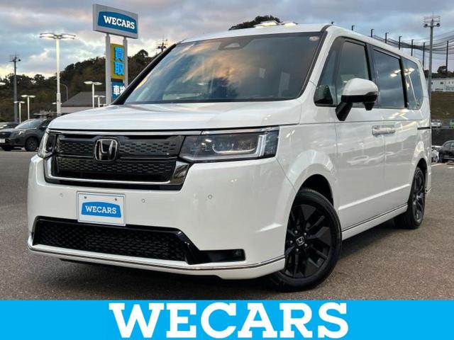 ステップワゴン(ホンダ) スパーダ　保証書／Aftermarket　９インチ　メモリーナビ／ホンダセンシング／両側電動スライドドア／シートヒーター　前席／車線逸脱防止支援システム／電動バックドア／登録済未使用車／ヘッドランプ　ＬＥＤ／ＵＳＢジャック 中古車画像