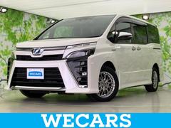 ヴォクシー ハイブリッドZSキラメキ2 新品タイヤ/保証書/社外 9インチ SDナビ/衝突安全装置/両側電動スライドドア/車線逸脱防止支援システム/ヘッドランプ LED/ETC/EBD付ABS/横滑り防止装置/アイドリングストップ 中古車画像