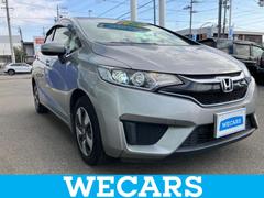 フィットハイブリッド ハイブリッド・Fパッケージ 新品タイヤ/保証書/社外 SDナビ/ヘッドランプ LED/Bluetooth接続/ETC/EBD付ABS/横滑り防止装置/アイドリングストップ/バックモニター/ワンセグTV/DVD/禁煙車 DVD再生 中古車画像