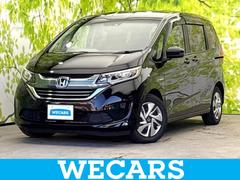 フリードハイブリッド ハイブリッドGホンダセンシング 新品タイヤ/保証書/純正 9インチ SDナビ/フリップダウンモニター/ホンダセンシング/両側電動スライドドア/車線逸脱防止支援システム/ドライブレコーダー 社外/ヘッドランプ LED バックカメラ 中古車画像