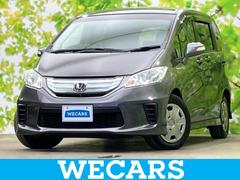 フリードハイブリッド ハイブリッドジャストセレクション 保証書/純正 SDナビ/両側電動スライドドア/Bluetooth接続/ETC/EBD付ABS/横滑り防止装置/アイドリングストップ/バックモニター/ワンセグTV/エアバッグ 運転席/エアバッグ 助手席 中古車画像