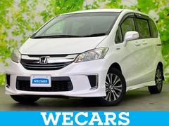 フリードハイブリッド ハイブリッドジャストセレクション 新品タイヤ/純正 9インチ SDナビ/両側電動スライドドア/シート ハーフレザー/ドライブレコーダー 前後/ヘッドランプ HID/Bluetooth接続/ETC/EBD付ABS/横滑り防止装置 中古車画像