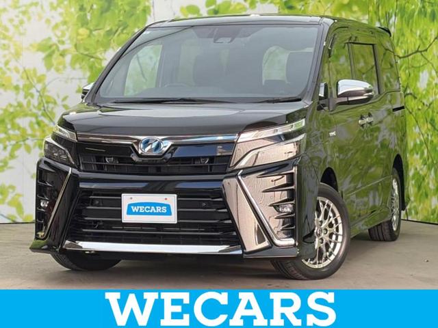 ヴォクシー(トヨタ) ハイブリッドＺＳキラメキ２　新品タイヤ／保証書／純正　１０インチ　ＳＤナビ／フリップダウンモニター　純正　１２．１インチ／トヨタセーフティセンス／両側電動スライドドア／シートヒーター　前席／車線逸脱防止支援システム 中古車画像