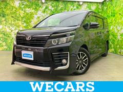 ヴォクシー ZS 社外 10インチ SDナビ/電動スライドドア/ヘッドランプ LED/Bluetooth接続/ETC/EBD付ABS/横滑り防止装置/バックモニター/フルセグTV/DVD/衝突安全ボディ バックカメラ 中古車画像