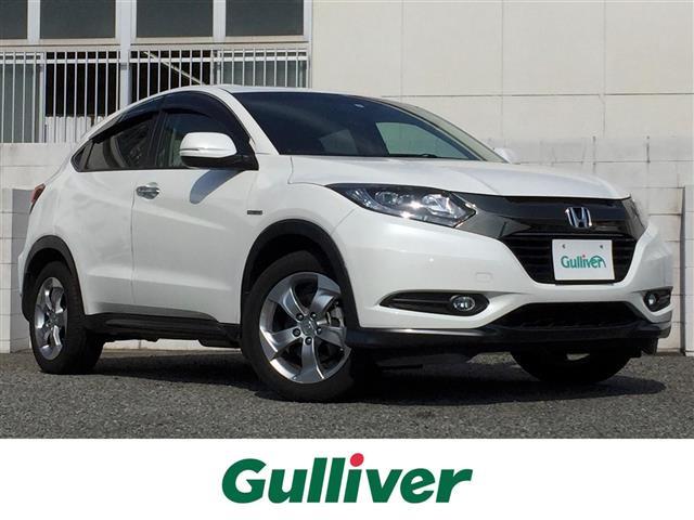 VEZEL(ヴェゼル)（ホンダ）ハイブリッド　純正８型ナビ／フルセグＴＶ／ＤＶＤ／音楽録音／Ｂｌｕｅｔｏｏｔｈ／バックカメラ／衝突軽減ブレーキ／レーダークルーズ／レーンキープアシスト／ＲＦＰ／ハーフレザーシート／シートヒーター／ドラレコ／ＥＴＣ 中古車画像