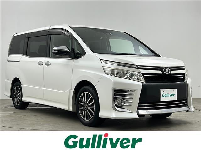 ヴォクシー ZS 煌 ワンオーナー 社外7インチメモリナビ フリップダウンモニター トヨタセーフティセンス バックカメラ 360°ドライブレコーダー 両側パワースライドドア LEDオートライト フォグランプ スマートキー(1枚目)