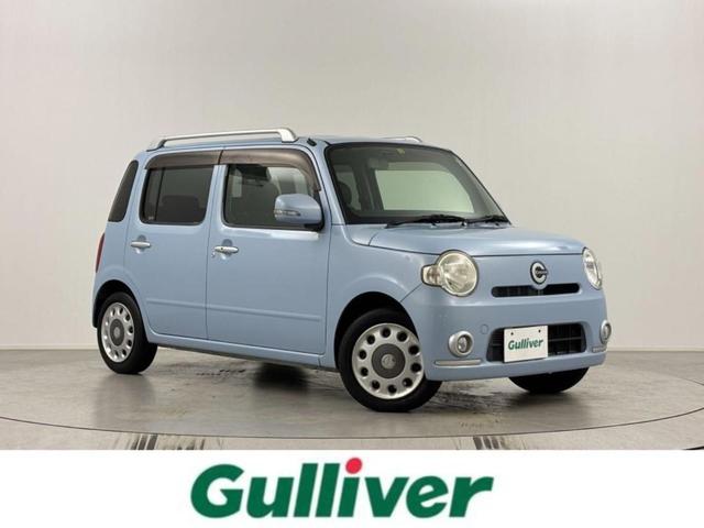 ココアプラスＸ　純正ナビ（ＣＤ／ＤＶＤ／ＡＵＸ／ＡＭ／ＦＭ）　地デジフルセグ　バックカメラ　前席シートカバー付　純正フロアマット　純正ドアバイザー　レベライザー　フロントフォグランプ　ウィンカーミラー　シガーソケット