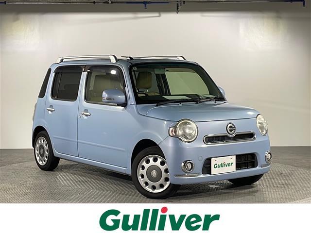 沖縄県の中古車ならミラココア ココアプラスＧ　禁煙車　県外仕入れ　純正ディーラーＯＰナビ　ワンセグＴＶ　ＣＤ　ＤＶＤ再生　ＡＵＸ接続機能　バックカメラ　スマートキー　シートカバー　ルーフレール　フォグランプ　ドアバイザー