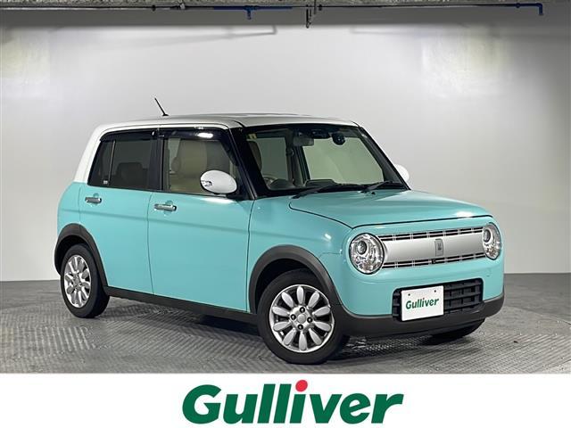 沖縄県の中古車ならアルトラパン Ｘ　禁煙車　ワンオーナー　９インチ純正ディーラーＯＰナビ【ＣＤ／ＤＶＤ／ＢＴ／フルセグＴＶ】　全方位カメラ　レーダーブレーキ　ＥＴＣ　前後ドライブレコーダー　運転席シートヒーター　　社外シートカバー