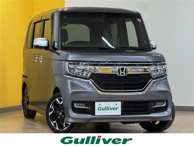 Ｎ－ＢＯＸカスタム Ｇ・Ｌターボホンダセンシング　禁煙車　衝突軽減　追従型クルコン　純正８インチナビ　フルセグＴＶ　ＢＴ　バックカメラ　両側電動ドア　ターボ　黒革　温シート　革巻きステアリング　ステアリングスイッチ　ビルトインＥＴＣ　スマートキー（1枚目）