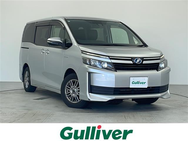 ヴォクシー ハイブリッドＸ　純正ナビ　ＮＳＰＣ－Ｗ６４　Ｂｌｕｅｔｏｏｔｈ　ＴＶ　ＡＭ　ＦＭ　ＣＤ　ＡＵＸ　片側パワースライドドア　Ｔｏｙｏｔａ　Ｓａｆｅｔｙ　Ｓｅｎｓｅ　Ｃ　低速域衝突回避支援ブレーキ機能　横滑り防止　ＥＴＣ（1枚目）