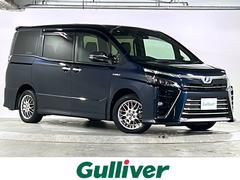 ヴォクシー ハイブリッドZS 煌 禁煙 純正10型ナビ 12型フリップダウンモニター HDMI/USB プリクラッシュ LDA オートマチックハイビーム 両側パワースライドドア シートヒーター LEDヘッドライト フォグランプ ETC 中古車画像