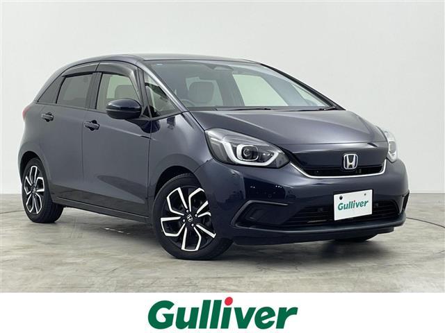 フィット(ホンダ) e:HEVホーム 禁煙車 純正ナビ フルセグ バックカメラ ホンダセンシング 追従クルーズコントロール レーンキープアシスト オートライト 前後ドライブレコーダー ETC 横滑り防止装置 フロントガラス熱線スイッチ 中古車画像