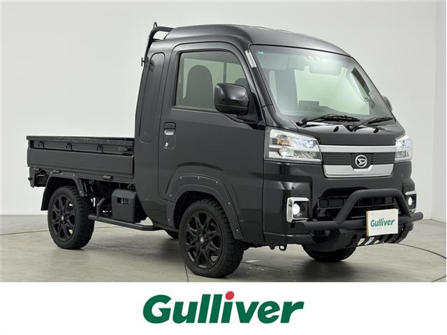 ハイゼットトラック(ダイハツ) ジャンボ エクストラ Aftermarketナビ Dampers バンパーガード MUD−Xアルミホイール ETC フルセグTV Bluetooth ツイーター Aftermarketステアリング フォグランプ 電動格納ミラー フォグランプ サイドステップ LED 中古車画像