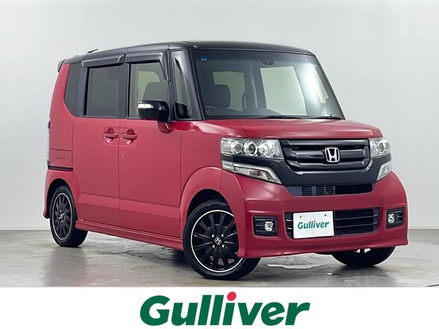 N−BOXカスタム(ホンダ) G ターボSSパッケージ 純正ナビ 地デジフルセグ バックカメラ ビルトインETC クルーズコントロール パドルシフト シートヒーター 低速域衝突軽減ブレーキ 両側電動 ロールサンシェード 純正フロアマット 純正ドアバイザー 中古車画像