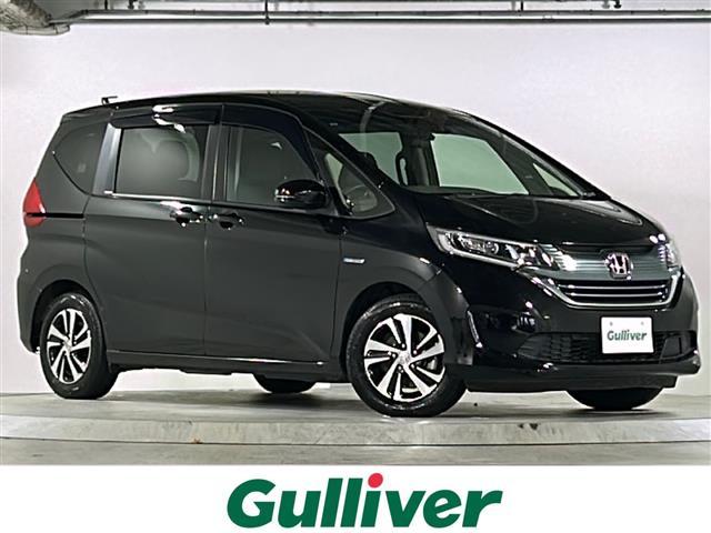 フリードハイブリッド(ホンダ) ハイブリッド・EX 禁煙車 純正7型ナビ バックカメラ ホンダセンシング Cパッケージ Sパッケージ 両側パワースライドドア ETC LEDコーナリングライト 前、後ドライブレコーダー ハーフレザー シートヒーター 中古車画像