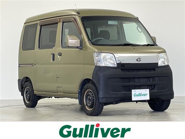 ハイゼットカーゴ(ダイハツ) クルーズリミテッド 5MT Aftermarketディスプレイオーディオ AM FM Bluetooth USB AUX 電動格納ミラー ヘッドライトレベライザー パワーウィンドウ 純正ドアバイザー Aftermarketフロアマット 中古車画像