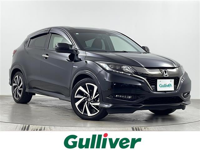 ヴェゼル(ホンダ) ハイブリッドRS・ホンダセンシング 純正ナビ バックカメラ フルセグテレビ ビルトインETC レーダークルーズコントロール 衝突被害軽減ブレーキ シートヒーター パドルシフト 自動防眩式ルームミラー ハーフレザーシート プッシュスタート 中古車画像