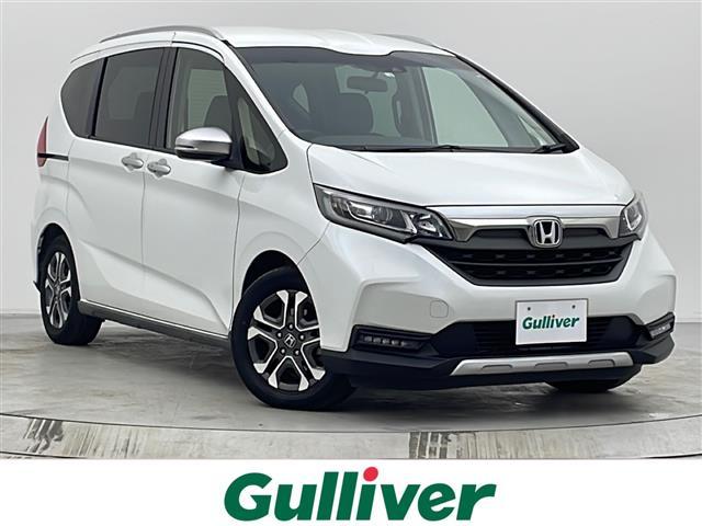 フリード(ホンダ) クロスター・ホンダセンシング 純正ナビ BT接続/フルセグTV/CD/DVD ホンダセンシング 衝突軽減ブレーキ(CMBS) 誤発進抑制機能 歩行者事故低減ステアリング 路外逸脱抑制機能 純正AW 純正フロアマット 中古車画像