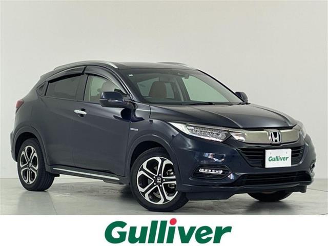 ヴェゼル(ホンダ) ハイブリッドZ・ホンダセンシング ホンダセンシング追従式クルコン車線逸脱衝突軽減ブレーキ純正SDナビゲーションBT/CD/DVD/フルセグ/FM/AMバックカメラハーフレザー前席シートヒーター純正17インチアルミ革巻ステアリングETC 中古車画像