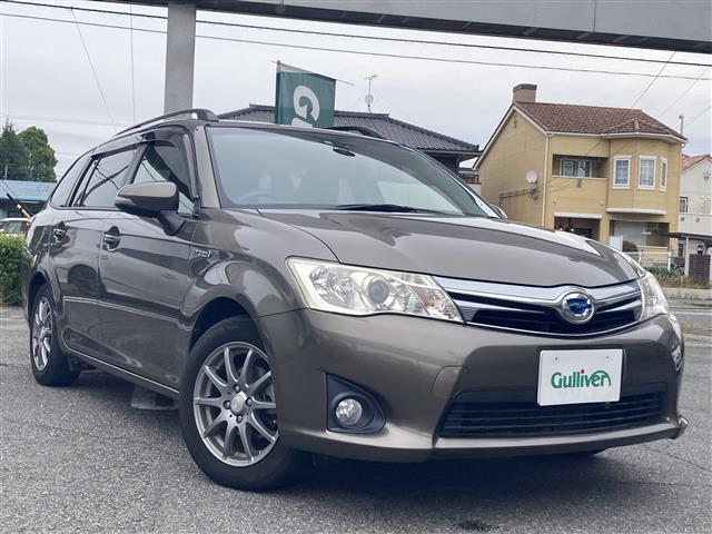 カローラフィールダー(トヨタ) ハイブリッドG スマートエントリー Aストップ ワンオーナー車 助手席エアバック ブルートゥースオーディオ フルセグ地デジTV シートヒーター エアバック カーテンエアバッグ DVD視聴可 ワイヤレスキー AAC 中古車画像