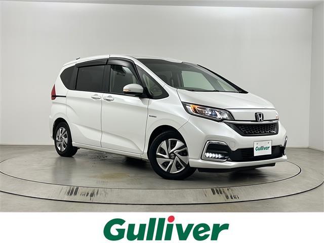 フリードハイブリッド(ホンダ) ハイブリッド・Gホンダセンシング 純正ナビ バックカメラ 前後ドライブレコーダー ビルトインETC 前席シートヒーター 両側パワースライドドア レーダークルーズコントロール レーンキープアシスト 衝突軽減システム LEDヘッドライト 中古車画像