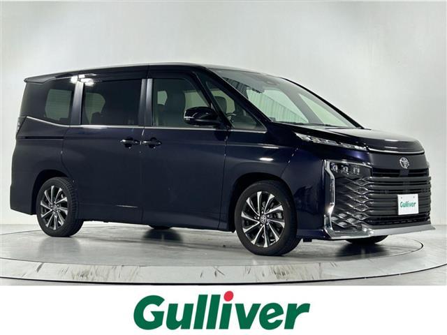 ヴォクシー(トヨタ) S−Z 純正10.5インチディスプレイオーディオ 純正14インチ有機EL後席モニター 快適利便パッケージHighシートヒーター オットマン ユニバーサルステップ プロジェクターLEDヘッドライト ナノイーX 中古車画像