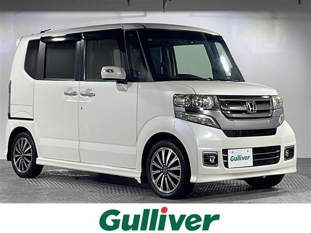 N−BOXカスタム(ホンダ) G・ターボLパッケージ 禁煙車 両側パワースライド Aftermarketナビ CD DVD フルセグTV ドライブレコーダー360° バックカメラ パドルシフト ターボ ステアリングスイッチ クルーズコントロール スペアキー 純正アルミ 中古車画像