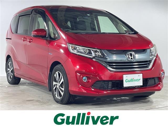 フリードハイブリッド(ホンダ) ハイブリッド・EX 純正ナビ9型(CD/DVD/AM/FM/Ipad)フルセグ バックカメラ ビルトインETC ホンダセンシング D/Nシートヒーター ハーフレザーシート クルーズコントロール コーナーセンサー 中古車画像